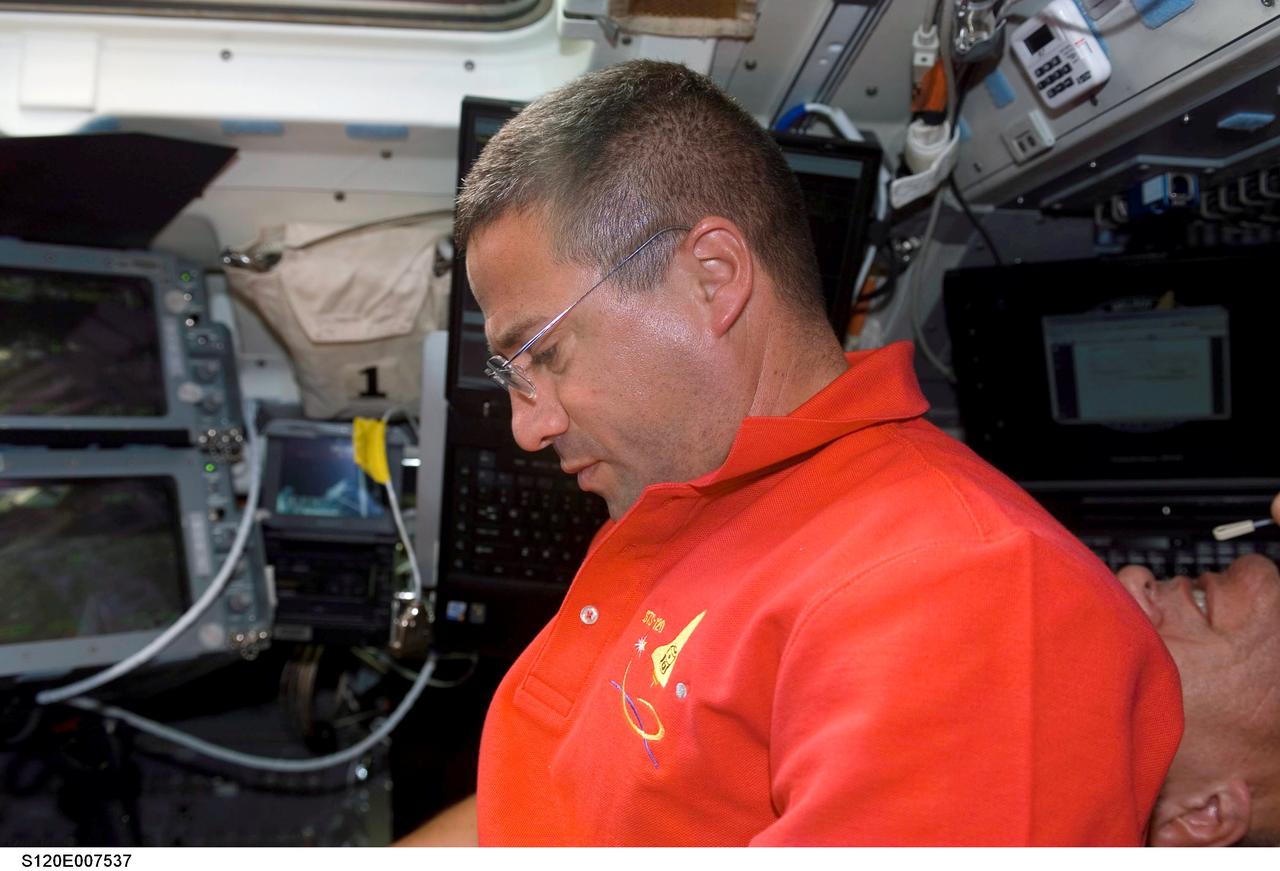S120-E-007537 (30 Oct. 2007) --- Astronaut George Zamka, STS-120 pilot, works on the flight deck of Space Shuttle Discovery during flight day eight activities while docked with the International Space Station.