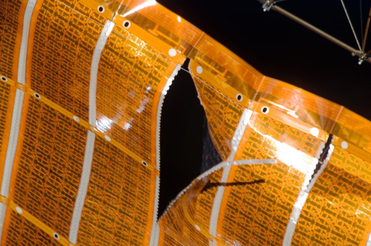 S120-E-008242 (3 Nov. 2007) --- One of a series of images of a two-foot tear in solar array material downlinked by the STS-120 crewmembers just a few hours prior to a two-person spacewalk scheduled to make repairs to the damaged area.  Discovery and International Space Station crewmembers have been rehearsing their respective roles in the spacewalk, in concert with personnel on the ground.