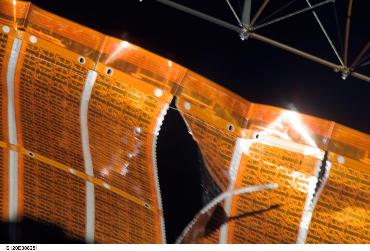 S120-E-008251 (3 Nov. 2007) --- One of a series of images of a two-foot tear in solar array material downlinked by the STS-120 crewmembers just a few hours prior to a two-person spacewalk scheduled to make repairs to the damaged area. Discovery and International Space Station crewmembers have been rehearsing their respective roles in the spacewalk, in concert with personnel on the ground.