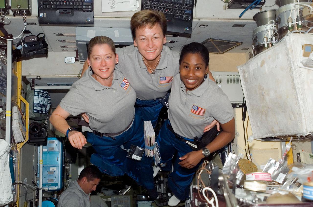 S120-E-008339 (4 Nov. 2007) --- Astronauts Pam Melroy (left), STS-120 commander; Peggy Whitson, Expedition 16 commander; and Stephanie Wilson, STS-120 mission specialist, pose for a photo in the Zvezda Service Module of the International Space Station while Space Shuttle Discovery is docked with the station.