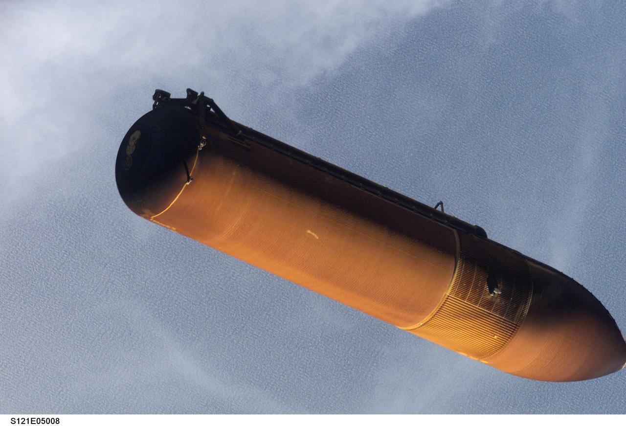 STS121-E-05008 (4 July 2006)-- This picture of the STS-121 external tank was taken with a digital still camera by an astronaut only seconds after separation from the Space Shuttle Discovery on launch day. Engineers, managers and flight controllers have carefully studied this image and other frames from this series as well as a number of pictures showing the falling ET as photographed from umbilical well cameras.