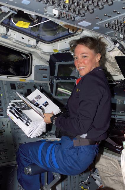 NASA image: Nowak reads a checklist during OBSS berthing operations on STS-121
