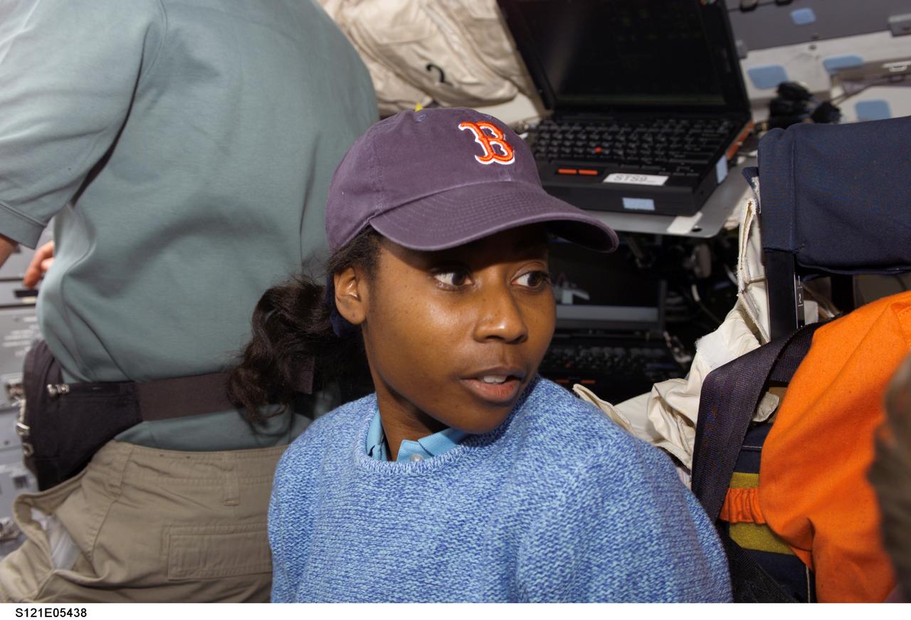 S121-E-05438 (5 July 2006) --- Astronaut Stephanie D. Wilson, STS-121 mission specialist, on Discovery's flight deck during flight day two activities, on the eve of one of the mission's busiest days -- docking day with the International Space Station.