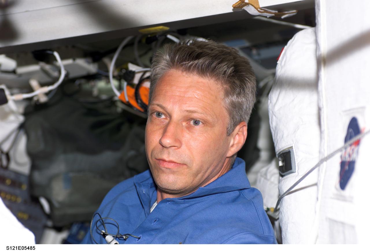 S121-E-05485 (6 July 2006) --- Astronaut Thomas Reiter, who represents the European Space Agency, is shown on the middeck of the Space Shuttle Discovery but will soon be moving into his new duties as the third member of the Expedition 13 crew onboard the International Space Station.