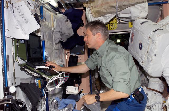 NASA image: Reiter uses a computer in the Node 1 module during STS-121/Exp. 13 OPS