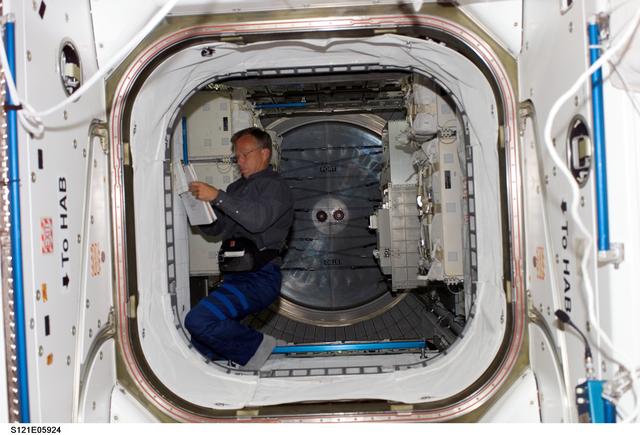 NASA image: Lindsey inside the MPLM module during STS-121/ Exp. 13 joint OPS
