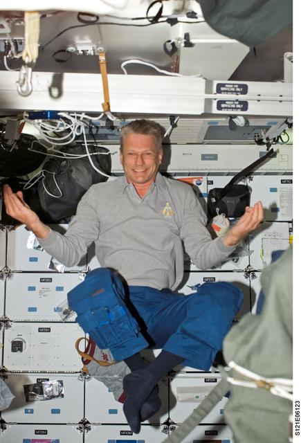NASA image: Sellers floats, meditation style, in the MDK on STS-121 / Expedition 13 joint operations