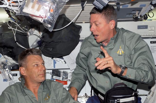 Fossum and Sellers talk on the MDK during STS-121 / Expedition 13 joint operations