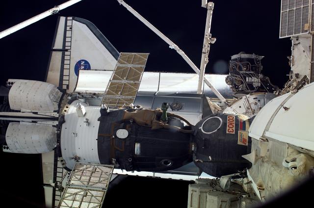 NASA image: A Soyuz vehicle, the orbiter,MPLM and ISS as viewed form the DC during STS-121 / Expedition 13 joint operations