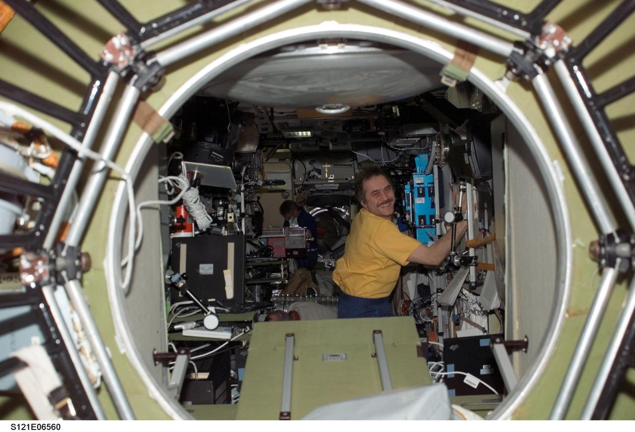 Vinogradov works inside the SM during STS-121 / Expedition 13 joint operations