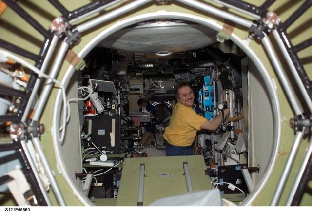 NASA image: Vinogradov works inside the SM during STS-121 / Expedition 13 joint operations