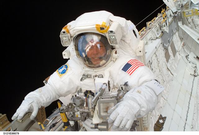 NASA image: Fossum smiles at the camera during EVA3 on STS-121 / Expedition 13 joint operations