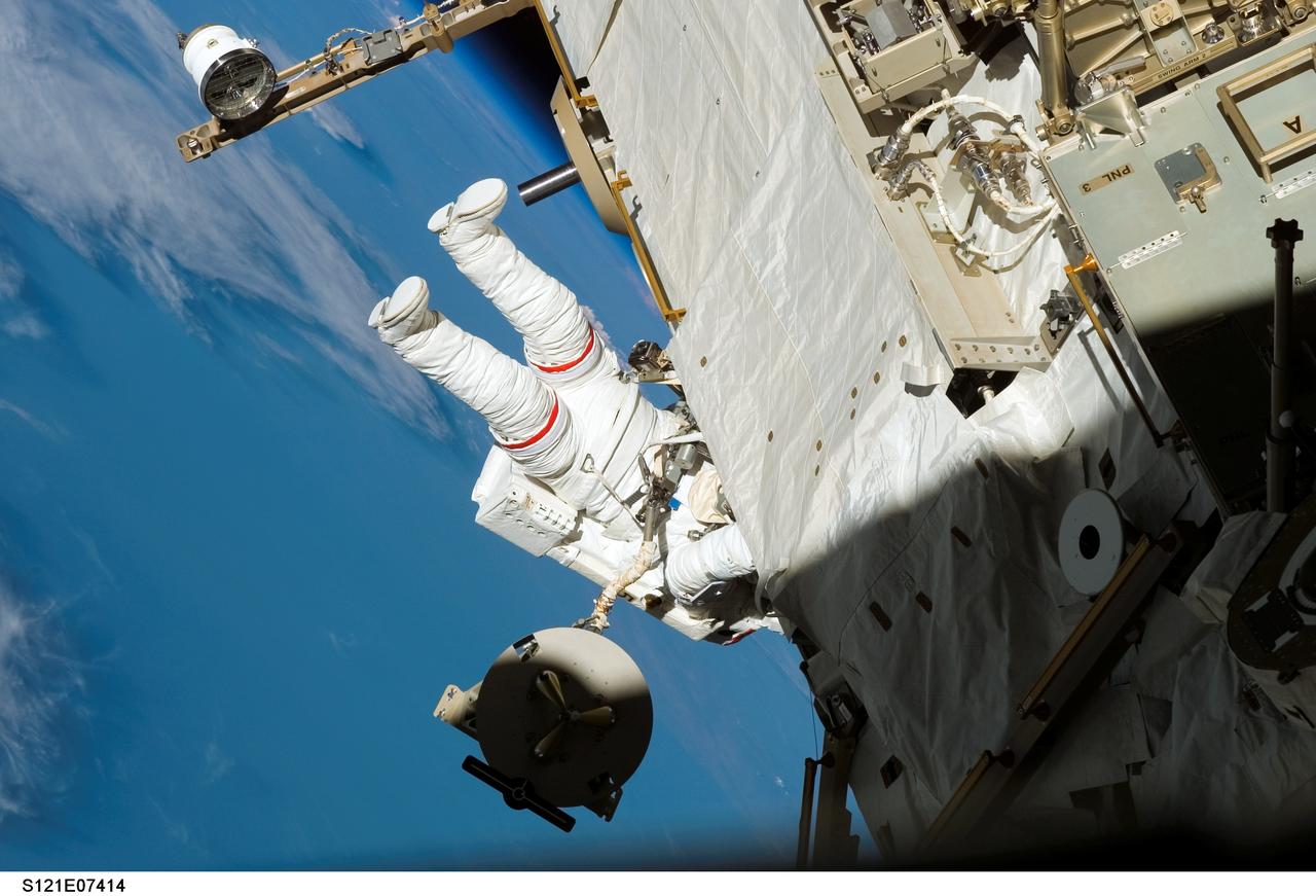 Sellers translates along the S1 Truss during EVA3 on STS-121 / Expedition 13 joint operations