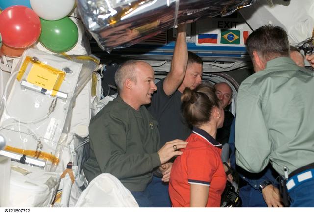 NASA image: Expedition 13 and STS-121 crewmembers say farewell before STS-121 undocking