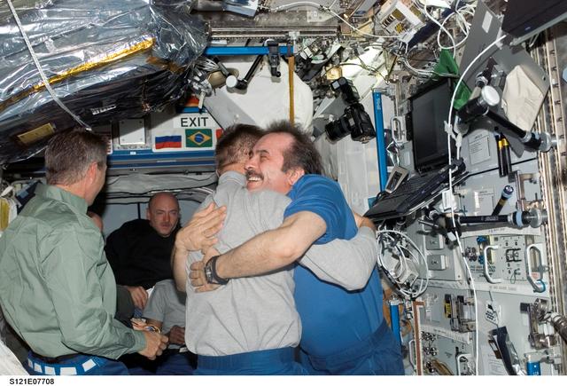 NASA image: Expedition 13 and STS-121 crewmembers say farewell before STS-121 undocking