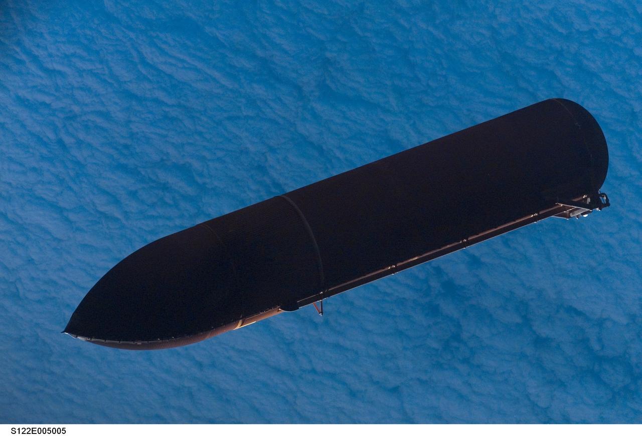 S122-E-005005 (7 Feb. 2008) --- Backdropped against a blanket of clouds, the STS-122 external fuel tank (ET) begins its relative separation from the Space Shuttle Atlantis. An STS-122 crewmember recorded the scene with a digital still camera.