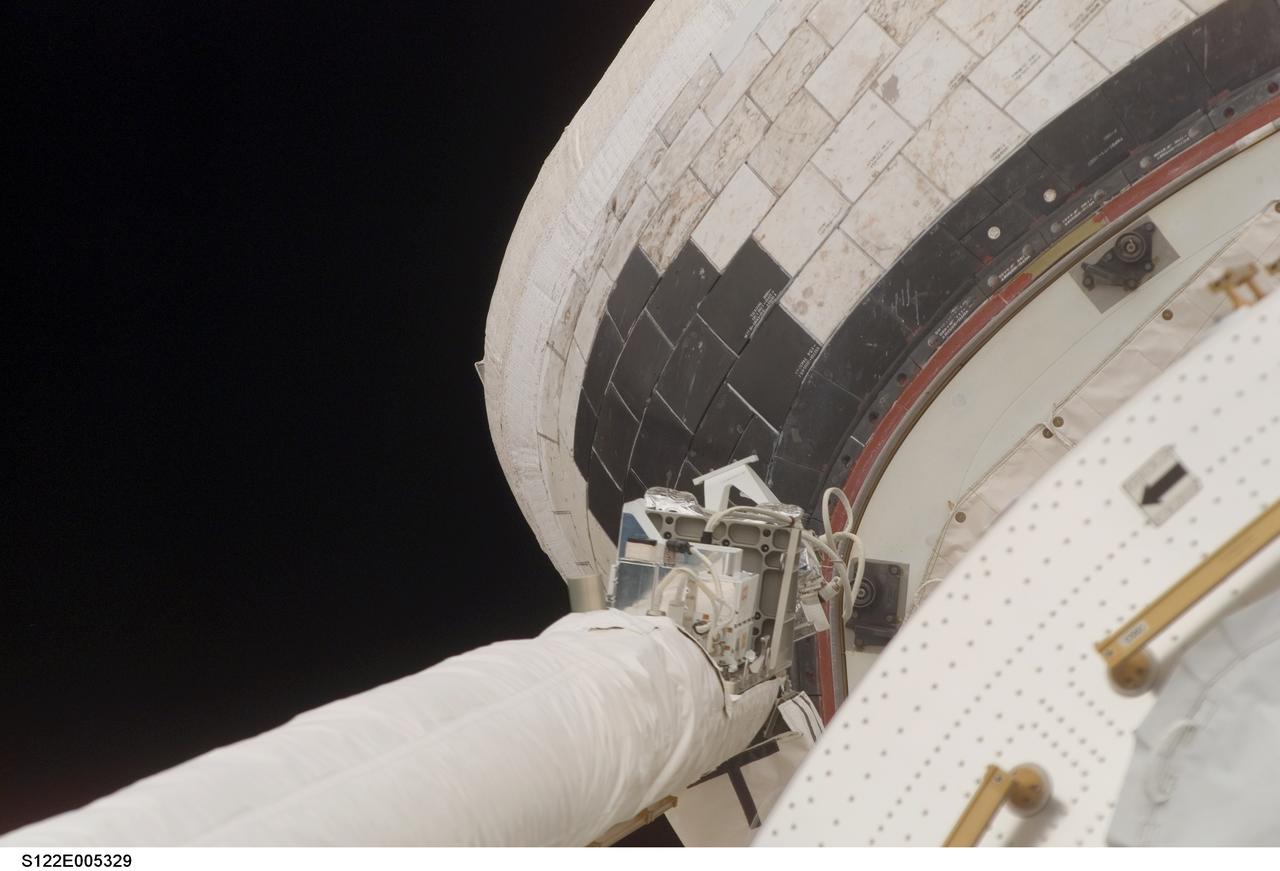 S122-E-005329 (8 Feb. 2008) --- This image, showing a slight protrusion of a thermal blanket on the starboard Orbital Maneuvering System (OMS) pod of Space Shuttle Atlantis, was photographed during a standard arm checkout and payload bay survey on Feb. 8, 2008.