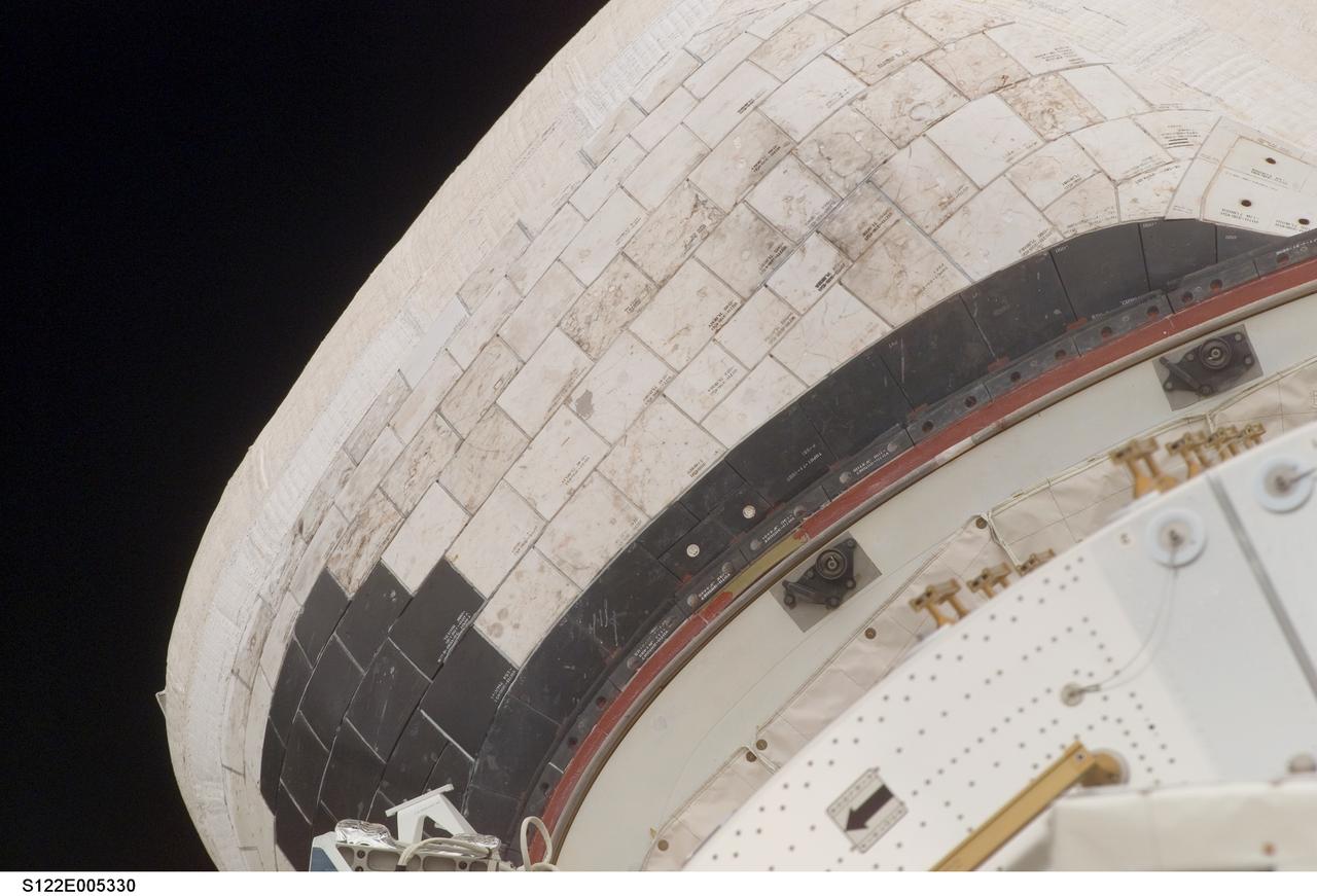 S122-E-005330 (8 Feb. 2008) --- This image, showing a slight protrusion of a thermal blanket on the starboard Orbital Maneuvering System (OMS) pod of Space Shuttle Atlantis, was photographed during a standard arm checkout and payload bay survey on Feb. 8, 2008.