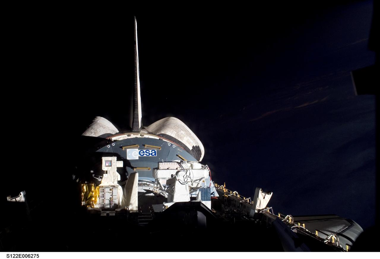 S122-E-006275 (8 Feb. 2008) --- Backdropped against the blackness of space, the European Space Agency's Columbus laboratory and associated ESA hardware sit in the aft portion of Space Shuttle Atlantis' cargo bay on the eve of the shuttle's scheduled docking to the International Space Station. The addition of Columbus to the orbital outpost is one of the primary tasks of the STS-122 mission.