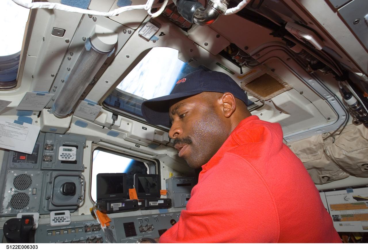 S122-E-006303 (8 Feb. 2008) --- Astronaut Leland Melvin, STS-122 mission specialist, works on the aft flight deck of Space Shuttle Atlantis during flight day two activities.