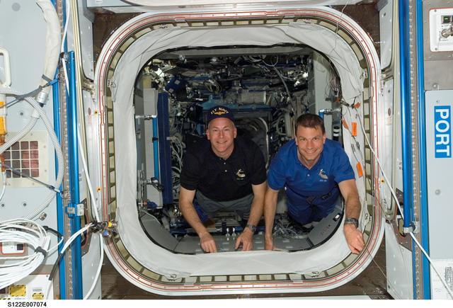NASA image: Poindexter and Love floating into Node 2