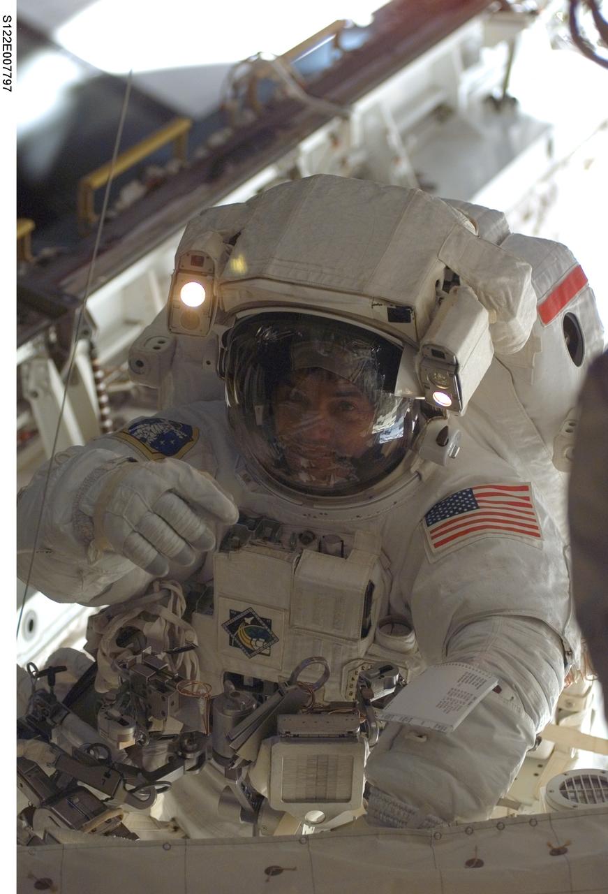 S122-E-007797 (11 Feb. 2008) --- Astronaut Rex Walheim, STS-122 mission specialist, participates in the first scheduled session of extravehicular activity (EVA) as construction and maintenance continue on the International Space Station. During the almost eight-hour spacewalk, Walheim and astronaut Stanley Love (out of frame), mission specialist, installed a grapple fixture on the Columbus laboratory and prepared electrical and data connections on the module while it rested inside Space Shuttle Atlantis' payload bay. The crewmembers also began work to replace a large nitrogen tank used for pressurizing the station's ammonia cooling system.