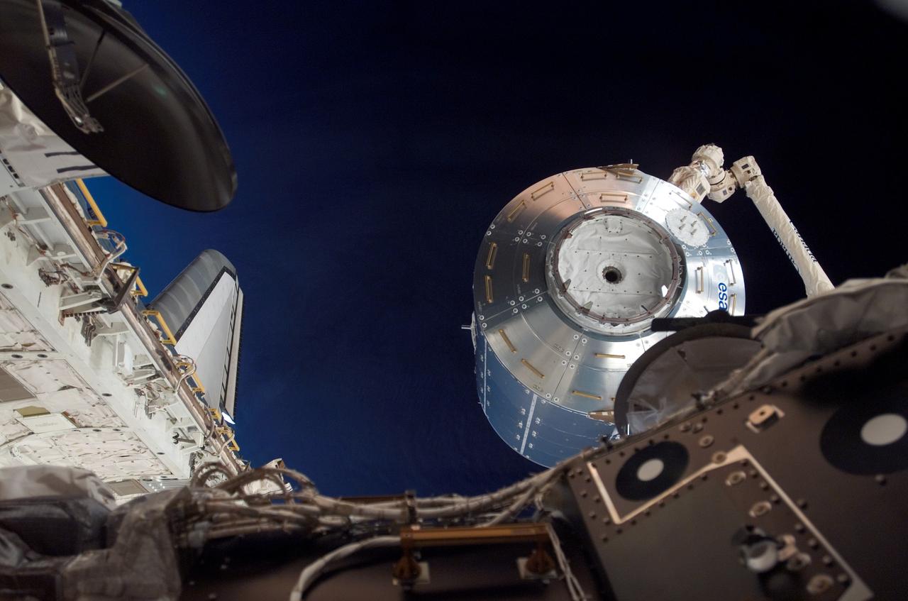 Columbus being moved into installation position by the SSRMS