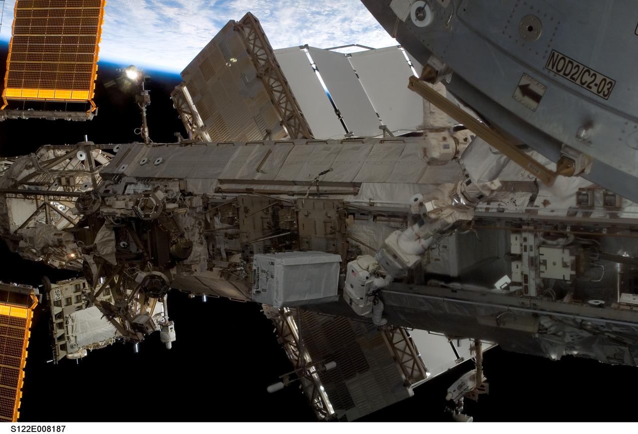 S122-E-008187 (13 Feb. 2008) --- European Space Agency (ESA) astronaut Hans Schlegel (left) and NASA astronaut Rex Walheim, both STS-122 mission specialists, participate in the mission's second scheduled session of extravehicular activity (EVA) as construction and maintenance continue on the International Space Station. During the six-hour, 45-minute spacewalk, among other tasks, Walheim and Schlegel worked to replace a nitrogen tank used to pressurize the station's ammonia cooling system.