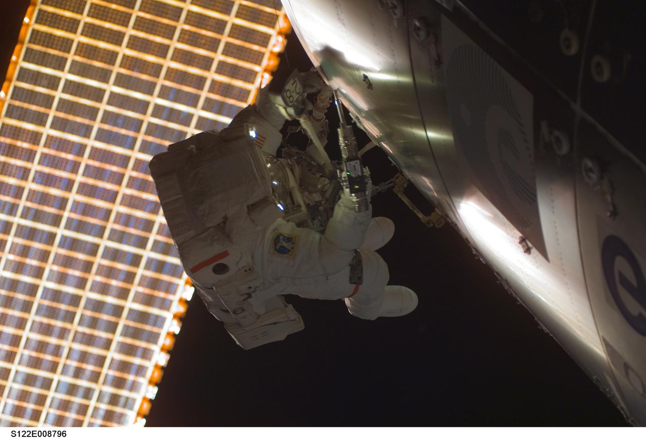 S122-E-008796 (15 Feb. 2008) --- Astronaut Rex Walheim, mission specialist, uses a power tool while installing a handrail on the Columbus laboratory, the newest piece of hardware on the International Space Station. Astronaut Stanley Love (out of frame), mission specialist, shared this extravehicular activity with Walheim.