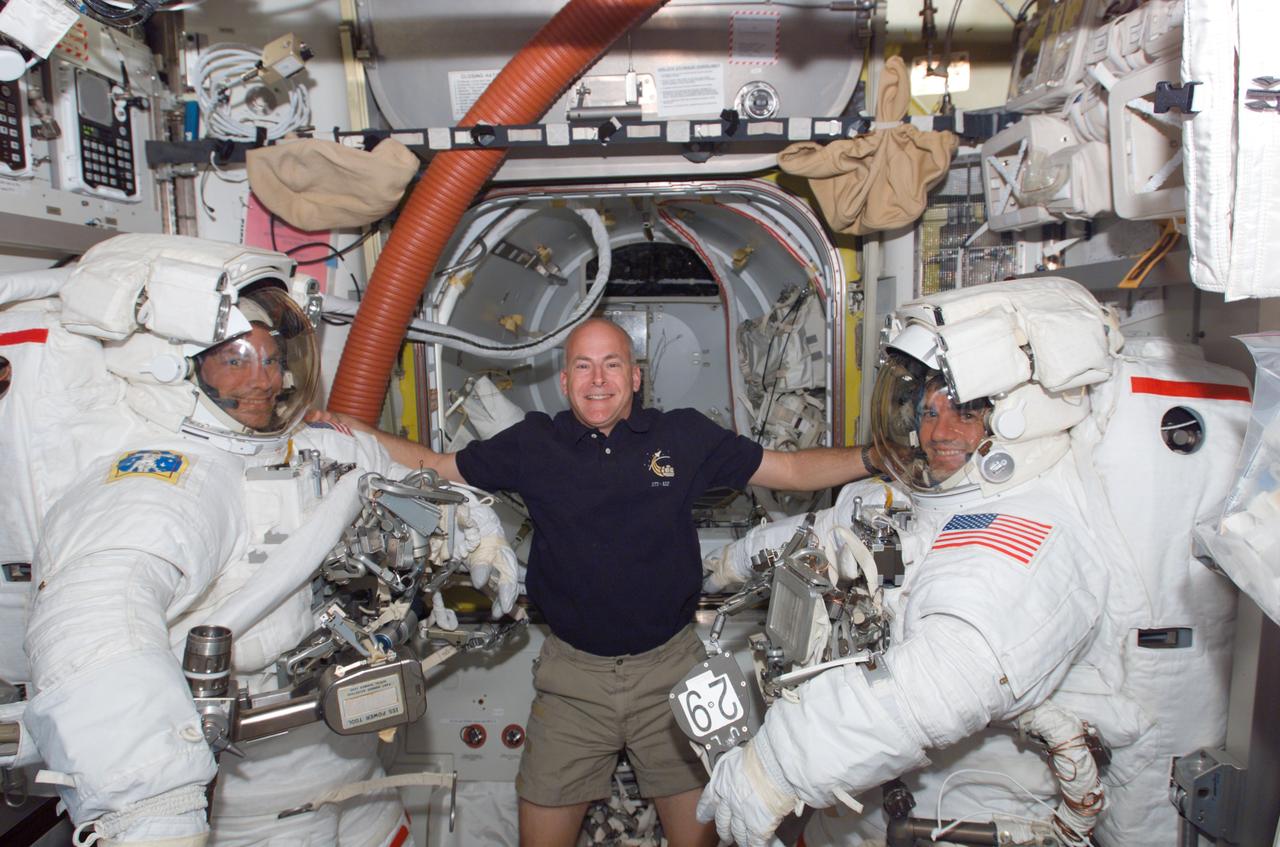 S122-E-008894 (15 Feb. 2008) --- Astronaut Alan Poindexter, STS-122 pilot, lends his intravehicular support to the two STS-122 mission specialists assigned to the mission's final spacewalk to perform work on the International Space Station. Equipped with their extravehicular mobility units (EMU) and other gear and just about ready to egress the station and begin the day's external tasks are astronauts Stanley Love (left) and Rex Walheim.