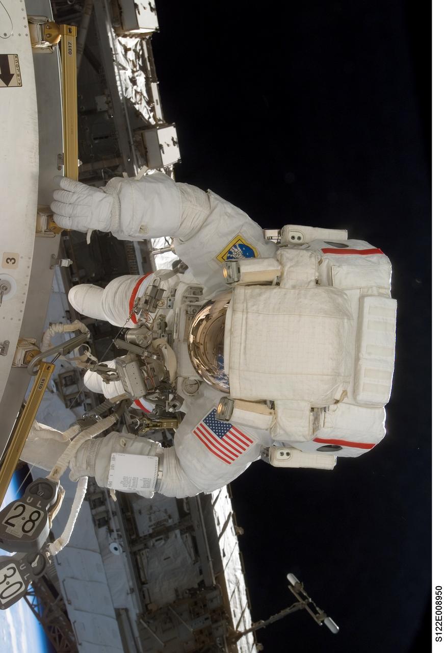 S122-E-008950 (15 Feb. 2008) --- Astronaut Rex Walheim, mission specialist, works on the new Columbus laboratory's exterior during the STS-122 Atlantis crew's final scheduled spacewalk. Astronaut Stanley Love (out of frame), mission specialist, shared this extravehicular activity with Walheim.