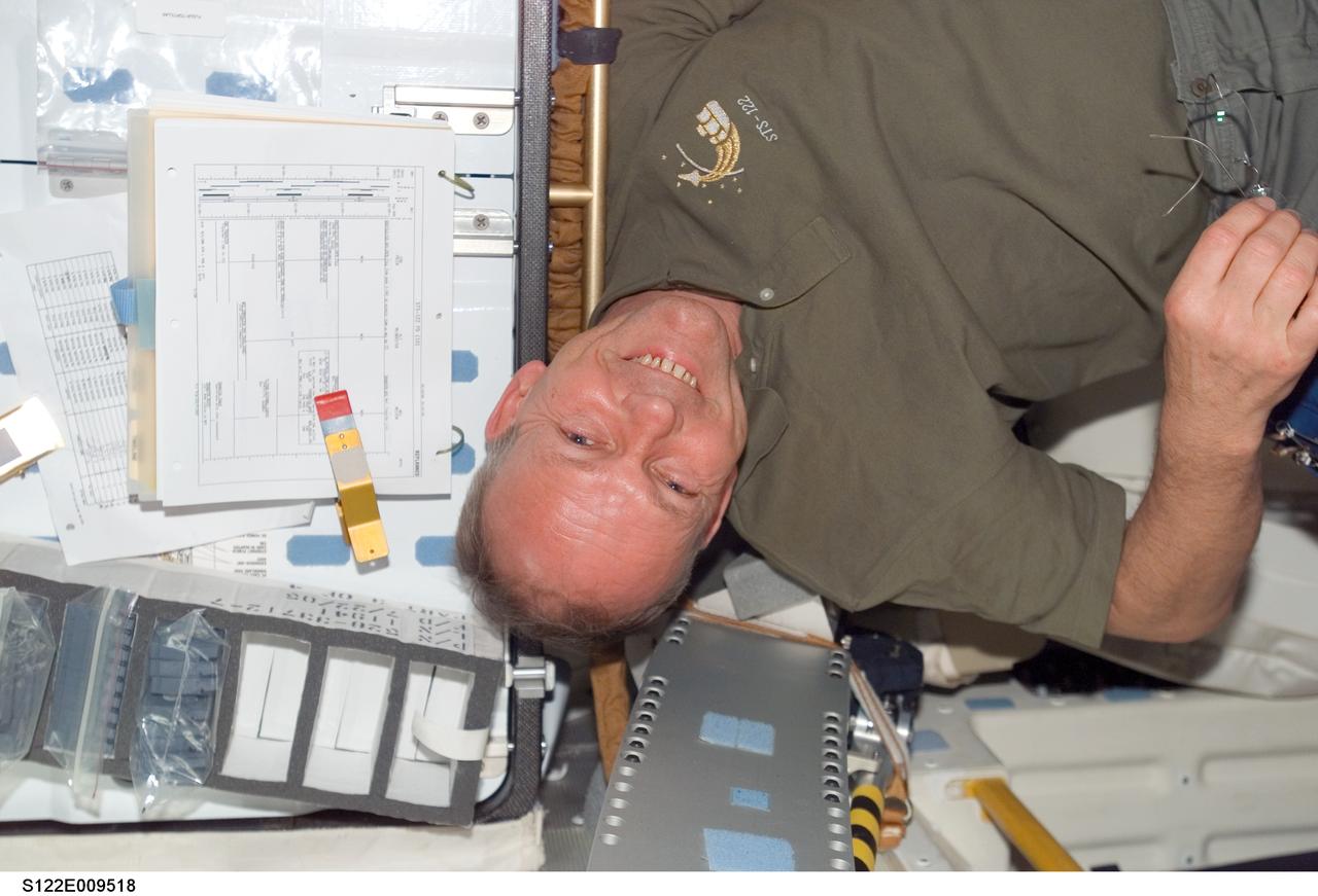 S122-E-009518 (16 Feb. 2008) --- European Space Agency (ESA) astronaut Hans Schlegel, STS-122 mission specialist, is pictured on the middeck of Space Shuttle Atlantis while docked with the International Space Station.