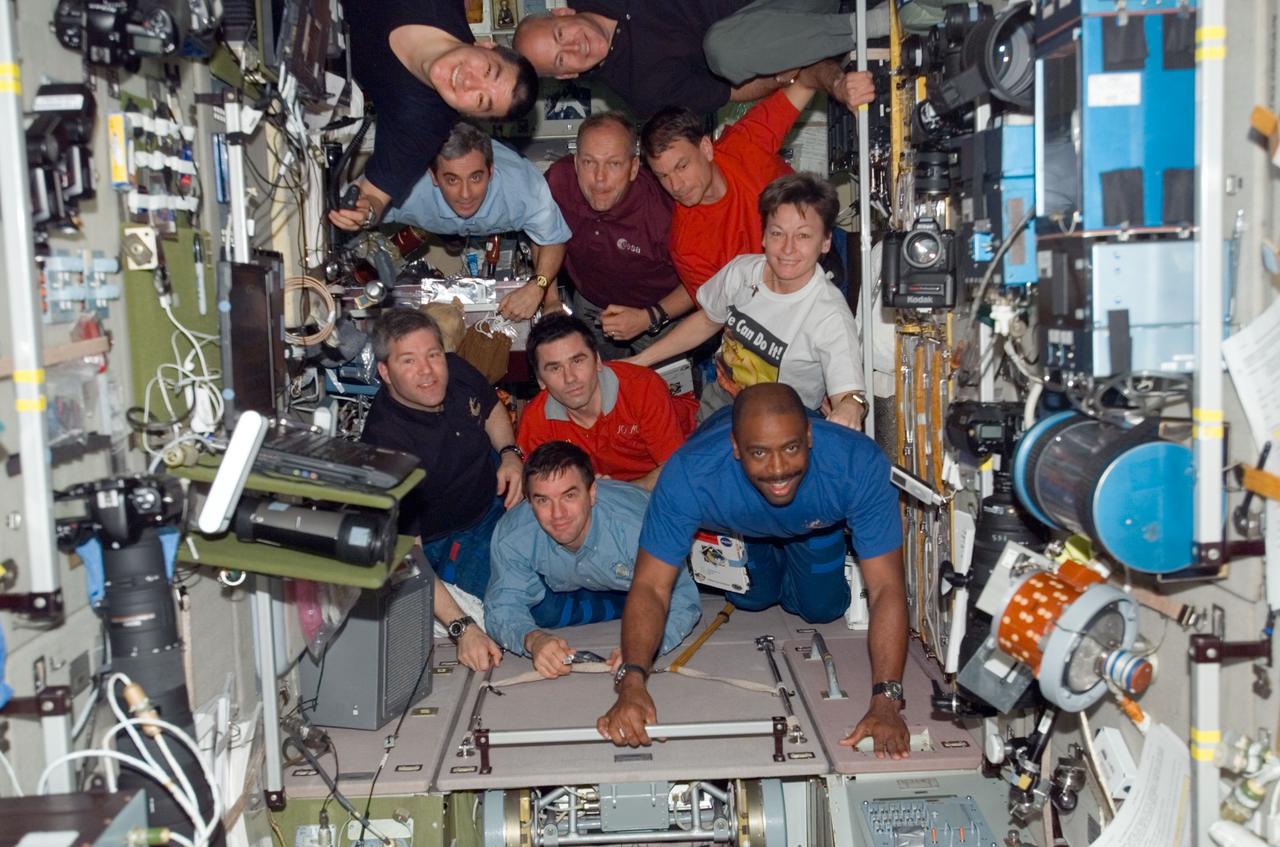 S122-E-009694 (17 Feb. 2008) --- The STS-122 and Expedition 16 crewmembers gather for a photo in the Zvezda Service Module of the International Space Station. NASA astronauts pictured are Steve Frick (bottom left), STS-122 commander; Rex Walheim (bottom center) and Leland Melvin (bottom right), both STS-122 mission specialists; Peggy Whitson, Expedition 16 commander; Stanley Love (above Whitson), STS-122 mission specialist; Alan Poindexter (top right), STS-122 pilot; and Daniel Tani (top left), STS-122 mission specialist. European Space Agency (ESA) astronauts pictured are Leopold Eyharts (left middle), Expedition 16 flight engineer; and Hans Schlegel, STS-122 mission specialist. Russia's Federal Space Agency cosmonaut Yuri I. Malenchenko, Expedition 16 flight engineer, is pictured above Walheim.