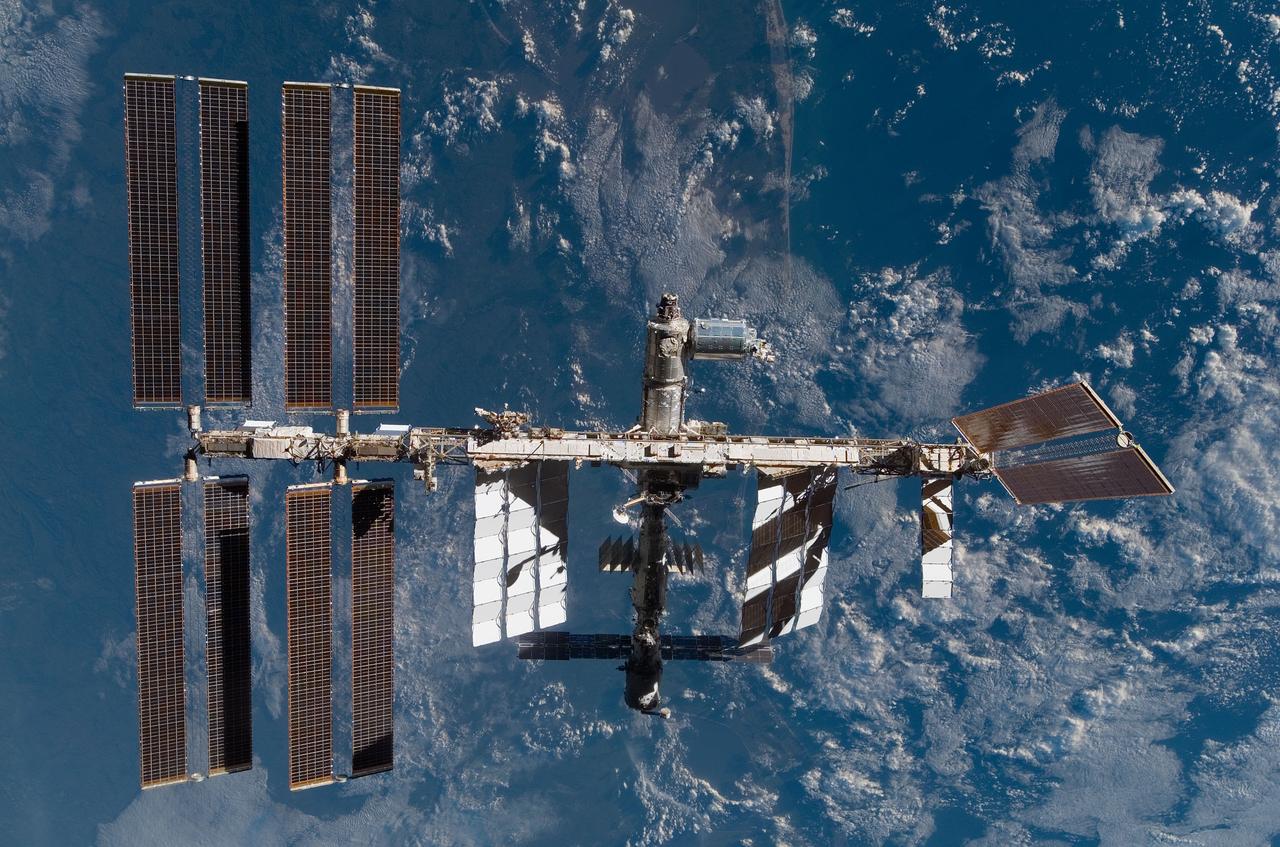 S122-E-009900 (18 Feb. 2008) --- Backdropped by a blue and white Earth, the International Space Station is seen from Space Shuttle Atlantis as the two spacecraft begin their relative separation. Earlier the STS-122 and Expedition 16 crews concluded almost nine days of cooperative work onboard the shuttle and station. Undocking of the two spacecraft occurred at 3:24 a.m. (CST) on Feb. 18, 2008.