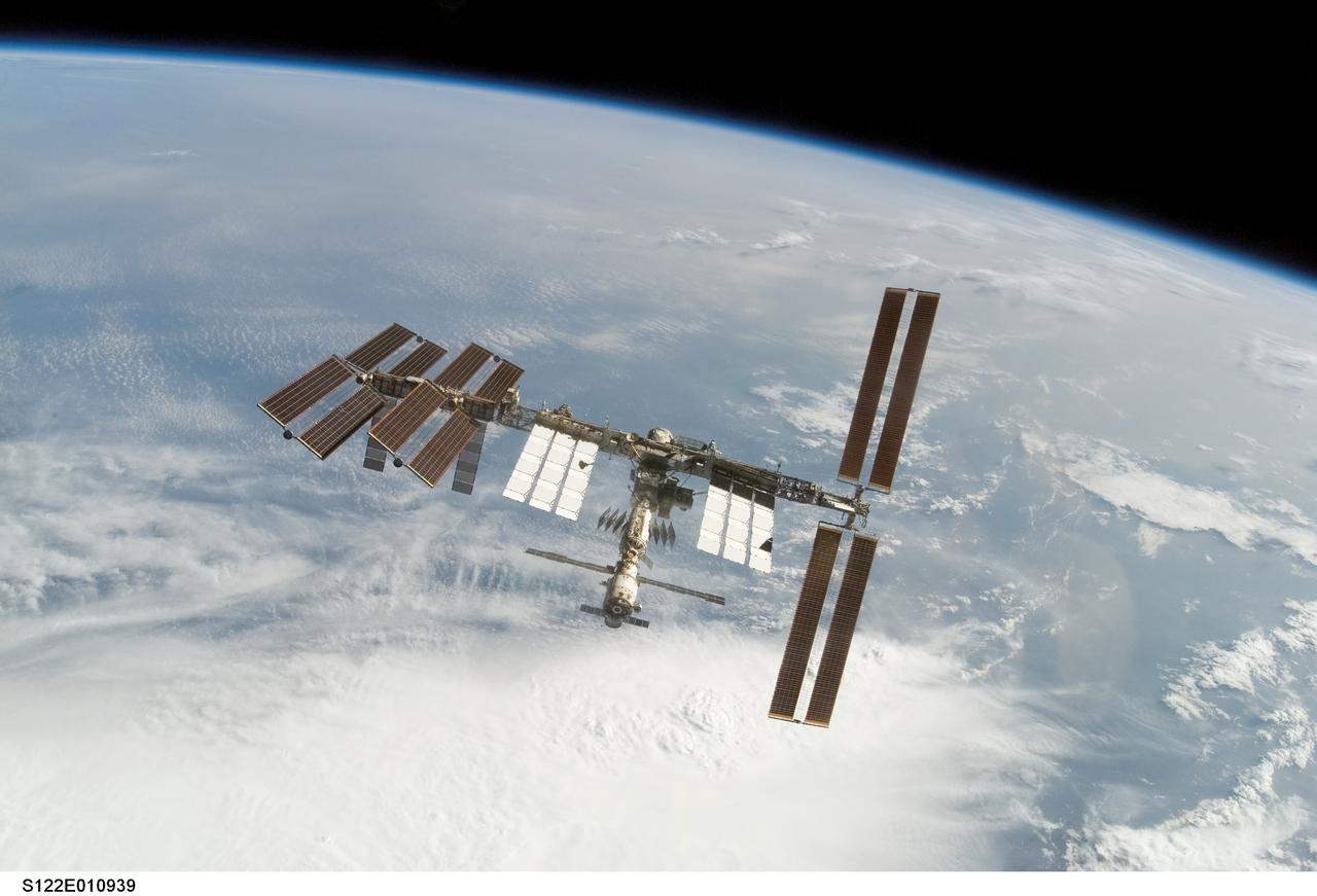 S122-E-010939 (18 Feb. 2008) --- Backdropped by Earth's horizon and the blackness of space, the International Space Station is seen from Space Shuttle Atlantis as the two spacecraft begin their relative separation. Earlier the STS-122 and Expedition 16 crews concluded almost nine days of cooperative work onboard the shuttle and station. Undocking of the two spacecraft occurred at 3:24 a.m. (CST) on Feb. 18, 2008.