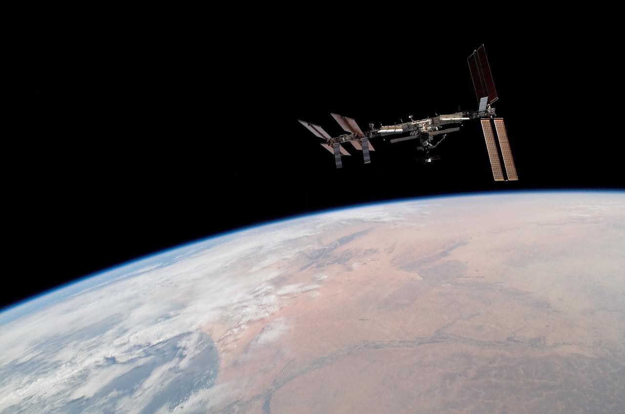 S122-E-010982 (18 Feb. 2008) --- Backdropped by Earth's horizon and the blackness of space, the International Space Station is seen from Space Shuttle Atlantis as the two spacecraft begin their relative separation. Earlier the STS-122 and Expedition 16 crews concluded almost nine days of cooperative work onboard the shuttle and station. Undocking of the two spacecraft occurred at 3:24 a.m. (CST) on Feb. 18, 2008.
