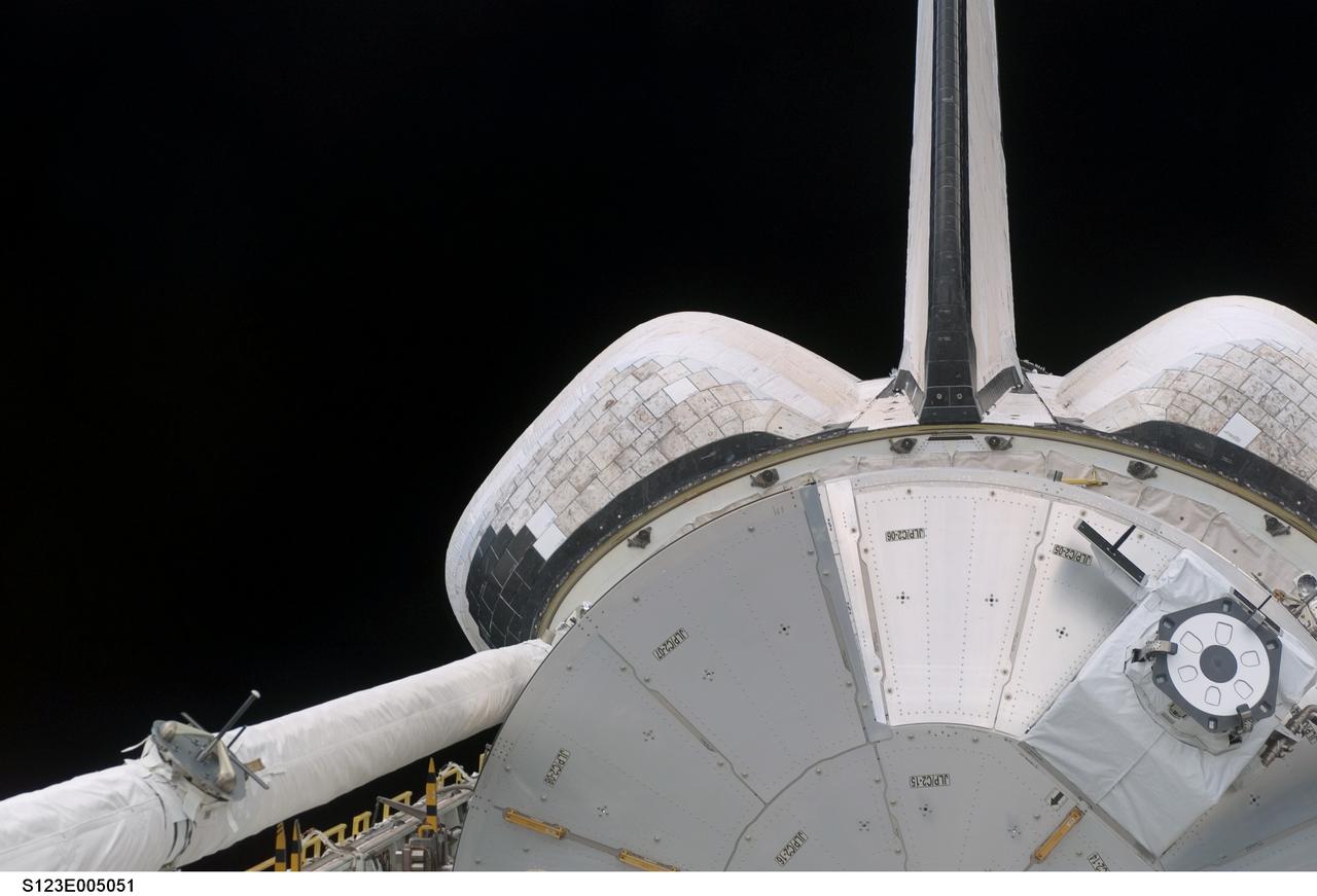 S123-E-005051 (11 Mar. 2008) --- During their first full day in space, STS-123 crewmembers aboard the Earth-orbiting Space Shuttle Endeavour  recorded and downlinked pictures of its cargo bay where the logistics module for the Japanese Kibo laboratory awaits being added to the   growing International Space Station.