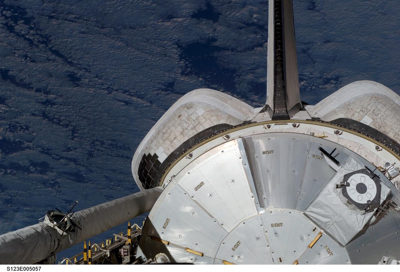 S123-E-005057 (11 Mar. 2008) --- During their first full day in space, STS-123 crewmembers aboard the Earth-orbiting Space Shuttle Endeavour  recorded and downlinked pictures of its cargo bay where the logistics module for the Japanese Kibo laboratory awaits being added to the   growing International Space Station.