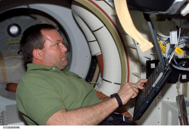 NASA image: Foreman uses computer in the MDDK during STS-123 mission
