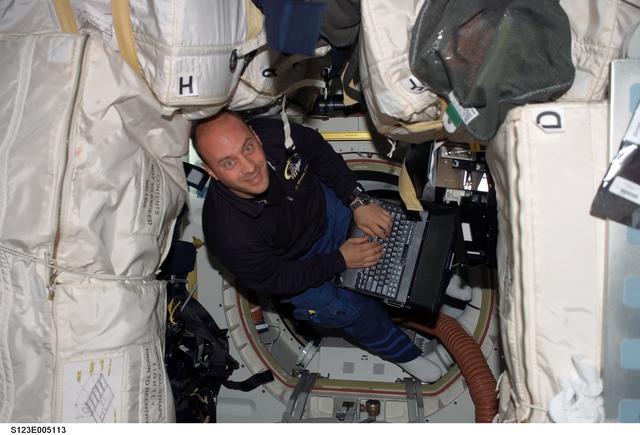 NASA image: Reisman uses computer in the MDDK during STS-123 mission