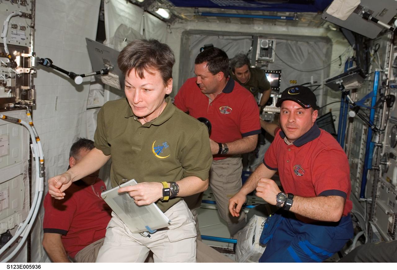 S123-E-005936 (13 March 2008) --- STS-123 and Expedition 16 crewmembers onboard the International Space Station work in the Columbus laboratory while Space Shuttle Endeavour is docked with the station. Pictured are NASA astronauts Peggy Whitson, Expedition 16 commander; Garrett Reisman (right), Expedition 16 flight engineer; Gregory H. Johnson (lower left), STS-123 pilot; Mike Foreman (center) and European Space Agency (ESA) astronaut Leopold Eyharts, both STS-123 mission specialists.