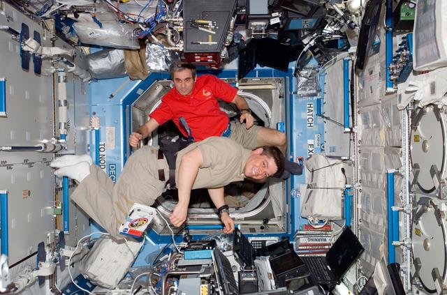 NASA image: STS-123 Crewmembers work at Robotic Controls during STS-123 / Expedition 16 Joint Operations