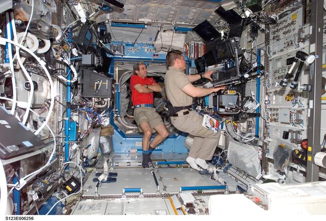 NASA image: STS-123 Crewmembers work at Robotic Controls during STS-123 / Expedition 16 Joint Operations