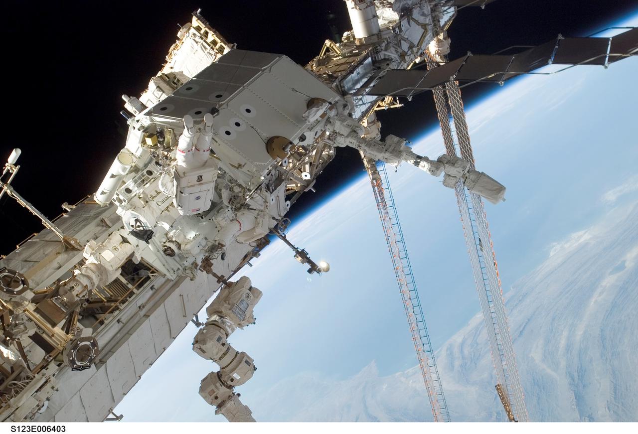 S123-E-006403 (15/16 March 2008) --- Astronauts Rick Linnehan and Mike Foreman, both STS-123 mission specialists, participate in the mission's second scheduled session of extravehicular activity (EVA) as construction and maintenance continue on the International Space Station. During the 7-hour, 8-minute spacewalk, Linnehan and Foreman, assembled the stick-figure-shaped Dextre, also known as the Special Purpose Dextrous Manipulator (SPDM), a task that included attaching its two arms. Designed for station maintenance and service, Dextre is capable of sensing forces and movement of objects it is manipulating. It can automatically compensate for those forces and movements to ensure an object is moved smoothly. Dextre is the final element of the station's Mobile Servicing System. The blackness of space and Earth's horizon provide the backdrop for the scene.