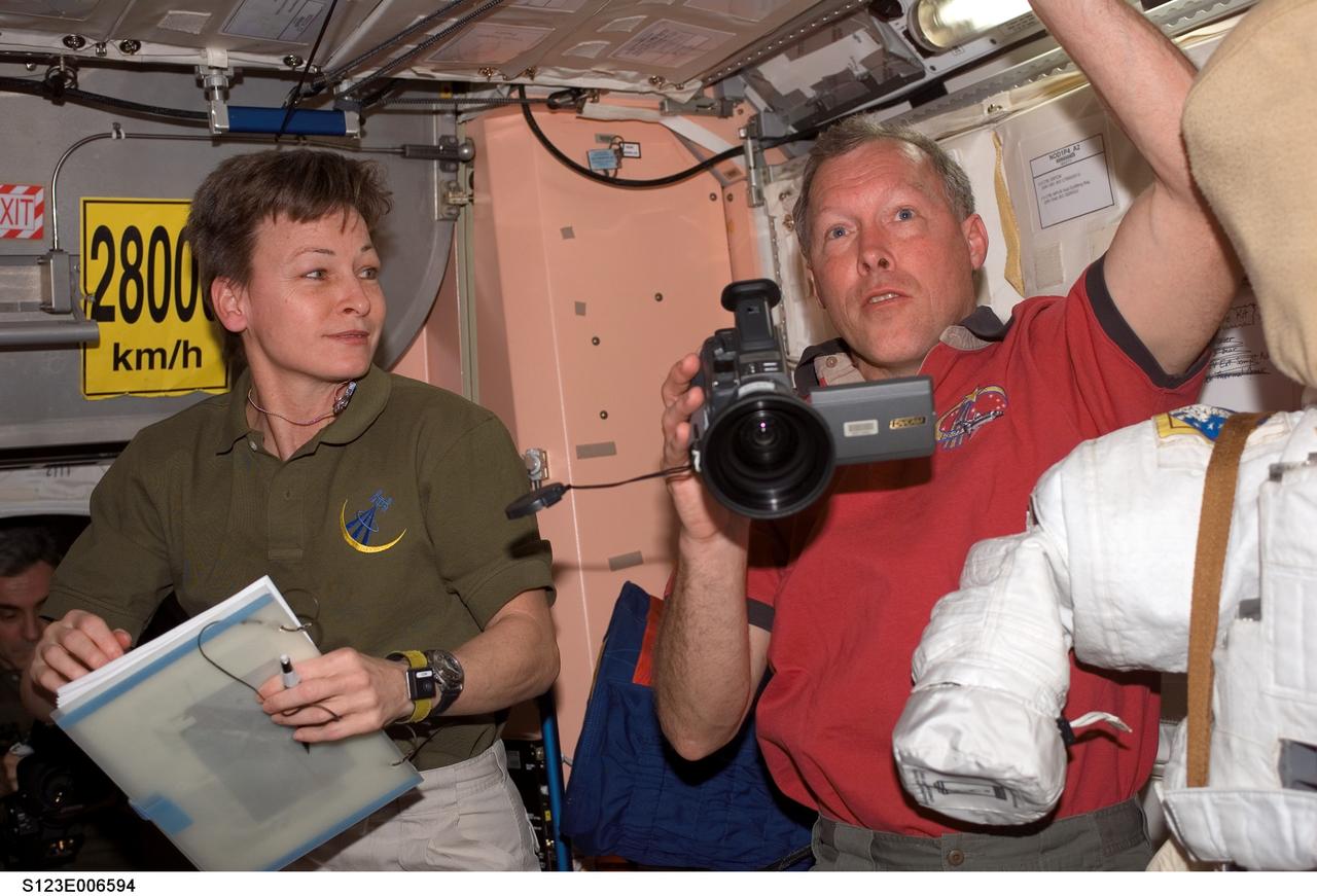 S123-E-006594 (13 March 2008) --- Astronauts Peggy Whitson, Expedition 16 commander; and Dominic Gorie, STS-123 commander, are pictured in the Unity node of the International Space Station while Space Shuttle Endeavour is docked with the station.