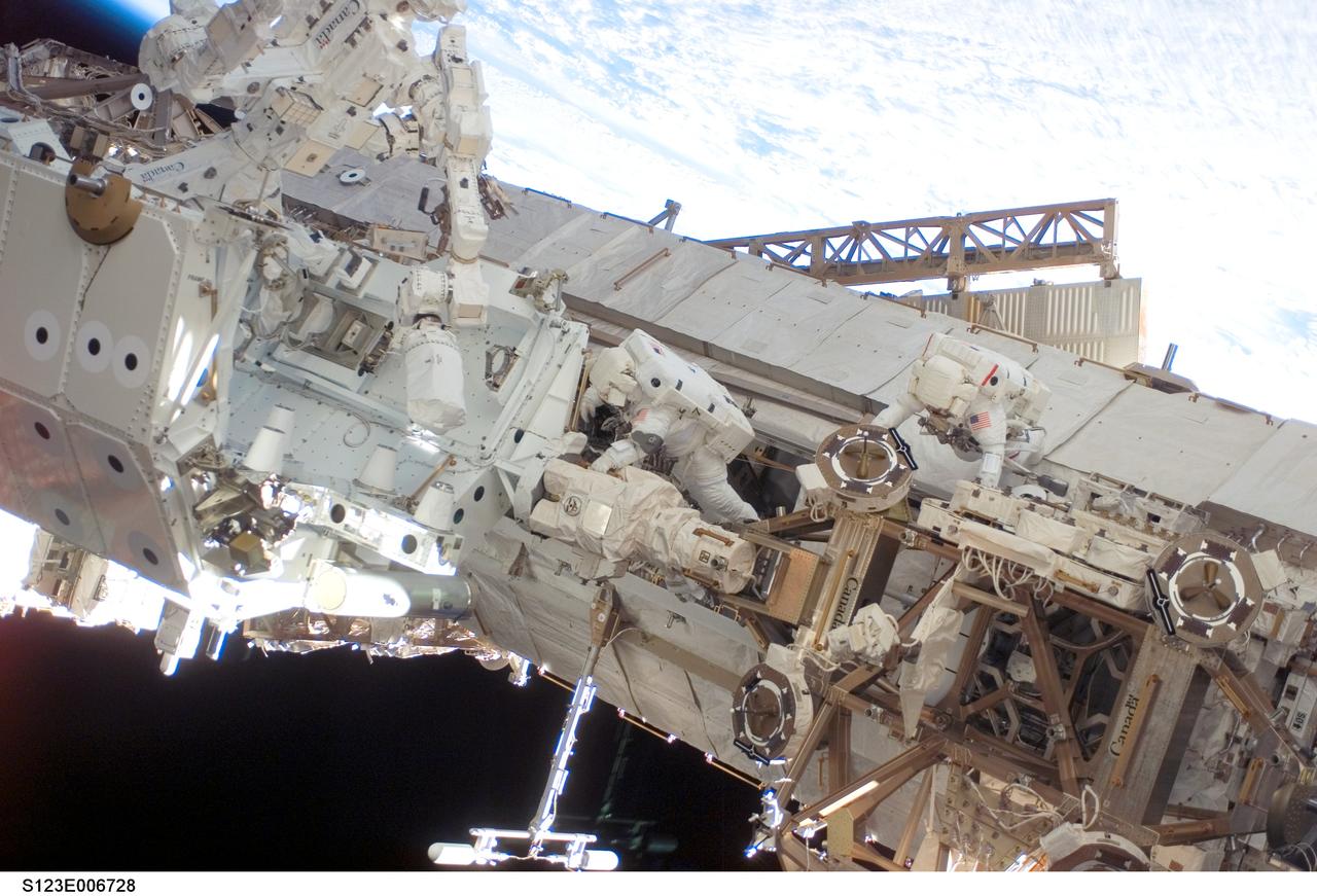 S123-E-006728 (17/18 March 2008) --- Astronauts Rick Linnehan (right) and Robert L. Behnken, both STS-123 mission specialists, participate in the mission's third scheduled session of extravehicular activity (EVA) as construction and maintenance continue on the International Space Station. During the 6-hour, 53-minute spacewalk, Linnehan and Behnken installed a spare-parts platform and tool-handling assembly for Dextre, also known as the Special Purpose Dextrous Manipulator (SPDM). Among other tasks, they also checked out and calibrated Dextre's end effector and attached critical spare parts to an external stowage platform. The new robotic system is scheduled to be activated on a power and data grapple fixture located on the Destiny laboratory on flight day nine.