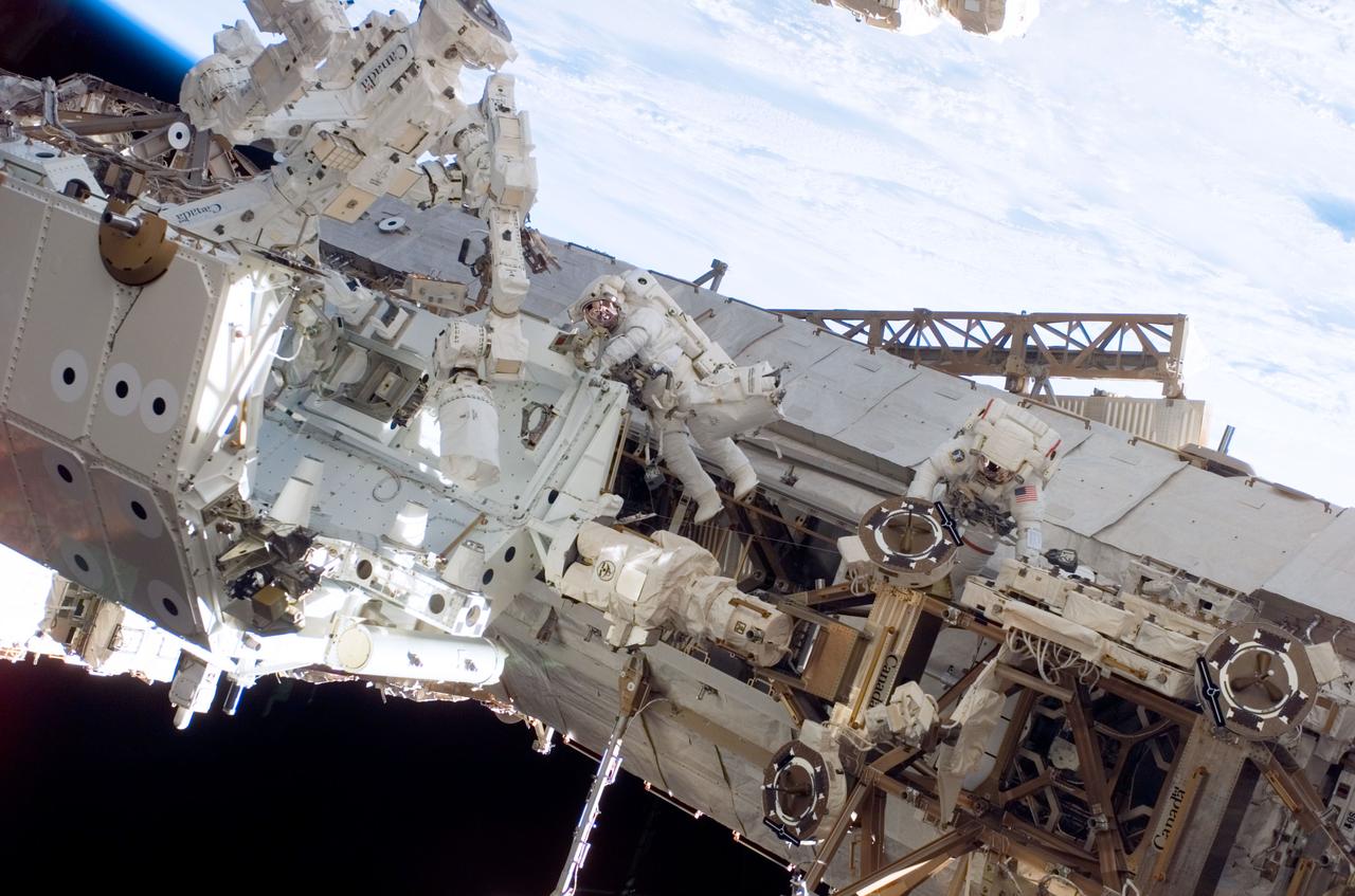 S123-E-006729 (17/18 March 2008) --- Astronauts Rick Linnehan (right) and Robert L. Behnken, both STS-123 mission specialists, participate in the mission's third scheduled session of extravehicular activity (EVA) as construction and maintenance continue on the International Space Station. During the 6-hour, 53-minute spacewalk, Linnehan and Behnken installed a spare-parts platform and tool-handling assembly for Dextre, also known as the Special Purpose Dextrous Manipulator (SPDM). Among other tasks, they also checked out and calibrated Dextre's end effector and attached critical spare parts to an external stowage platform. The new robotic system is scheduled to be activated on a power and data grapple fixture located on the Destiny laboratory on flight day nine.