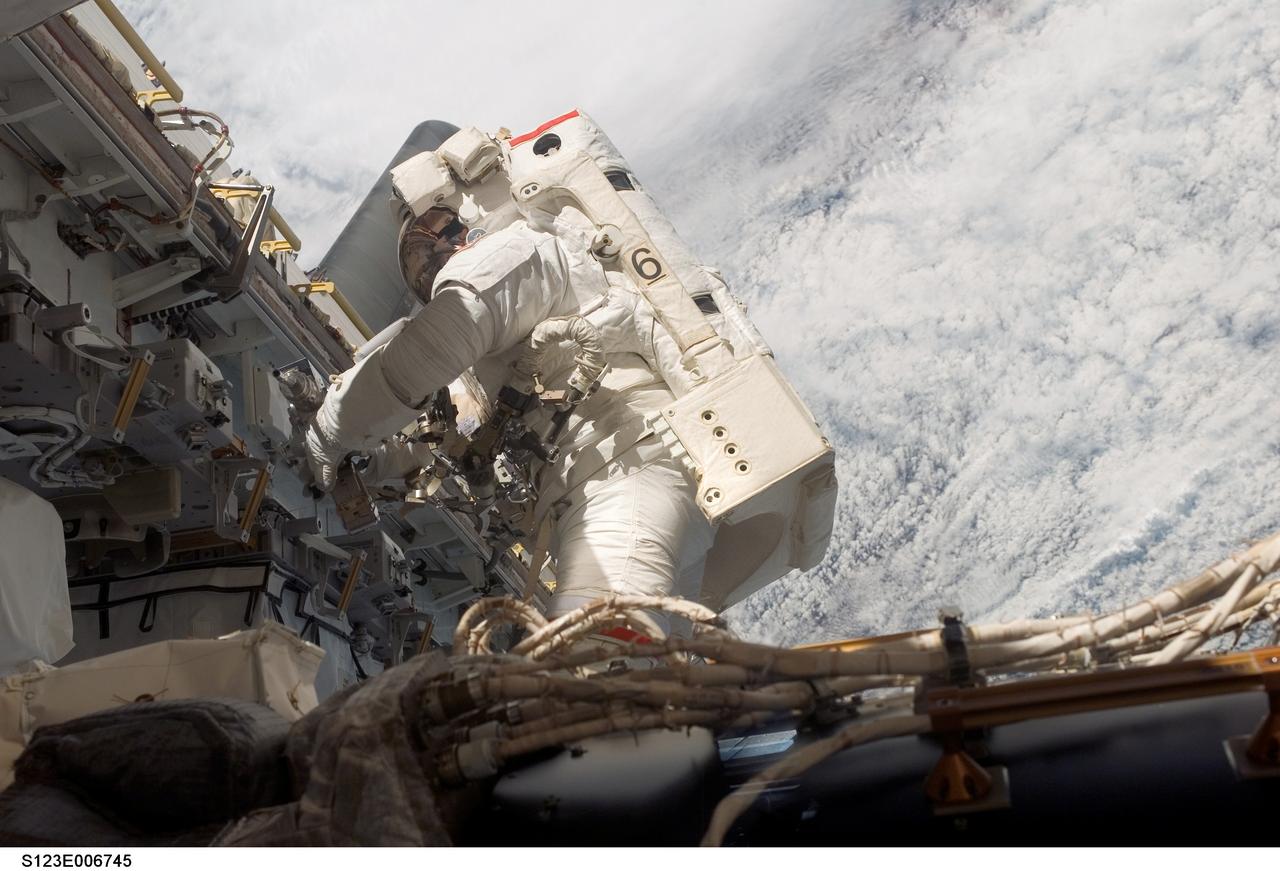 S123-E-006745 (17/18 March 2008) --- Astronaut Rick Linnehan, STS-123 mission specialist, participates in the mission's third scheduled session of extravehicular activity (EVA) as construction and maintenance continue on the International Space Station. During the 6-hour, 53-minute spacewalk, Linnehan and astronaut Robert L. Behnken (out of frame), mission specialist, installed a spare-parts platform and tool-handling assembly for Dextre, also known as the Special Purpose Dextrous Manipulator (SPDM). Among other tasks, they also checked out and calibrated Dextre's end effector and attached critical spare parts to an external stowage platform. The new robotic system is scheduled to be activated on a power and data grapple fixture located on the Destiny laboratory on flight day nine.