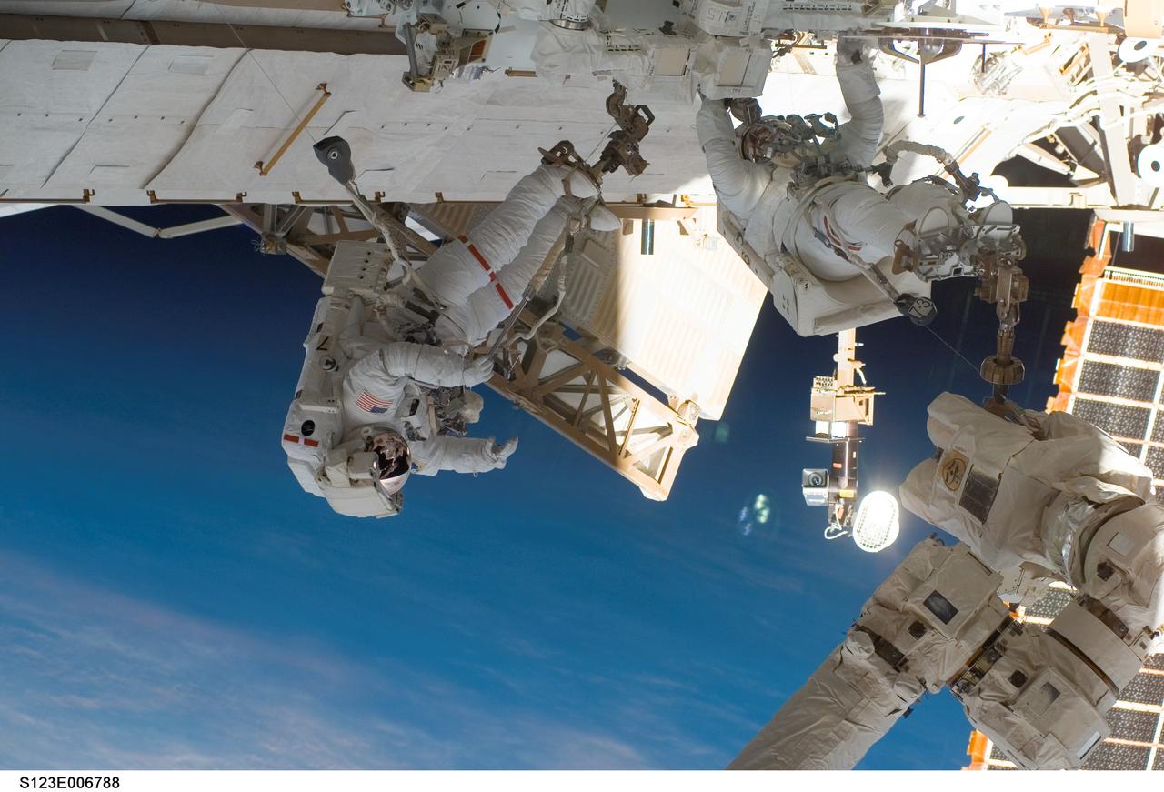 S123-E-006788 (15/16 March 2008) --- Astronauts Mike Foreman (left) and Rick Linnehan, both STS-123 mission specialists, participate in the mission's second scheduled session of extravehicular activity (EVA) as construction and maintenance continue on the International Space Station. During the 7-hour, 8-minute spacewalk, Linnehan and Foreman, assembled the stick-figure-shaped Dextre, also known as the Special Purpose Dextrous Manipulator (SPDM), a task that included attaching its two arms. Designed for station maintenance and service, Dextre is capable of sensing forces and movement of objects it is manipulating. It can automatically compensate for those forces and movements to ensure an object is moved smoothly. Dextre is the final element of the station's Mobile Servicing System.
