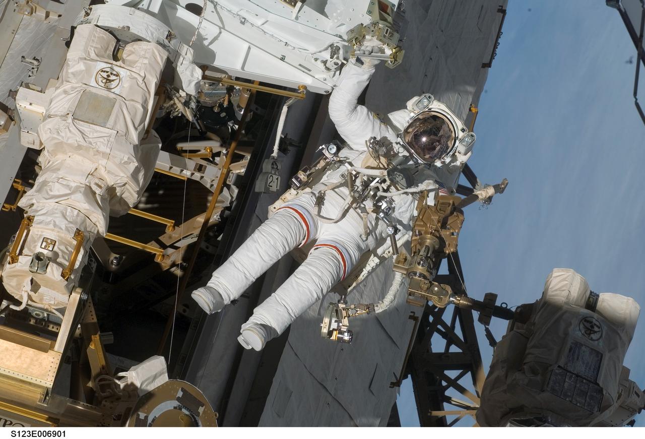 S123-E-006901 (17/18 March 2008) --- Astronaut Rick Linnehan, STS-123 mission specialist, participates in the mission's third scheduled session of extravehicular activity (EVA) as construction and maintenance continue on the International Space Station. During the 6-hour, 53-minute spacewalk, Linnehan and astronaut Robert L. Behnken (out of frame), mission specialist, installed a spare-parts platform and tool-handling assembly for Dextre, also known as the Special Purpose Dextrous Manipulator (SPDM). Among other tasks, they also checked out and calibrated Dextre's end effector and attached critical spare parts to an external stowage platform. The new robotic system is scheduled to be activated on a power and data grapple fixture located on the Destiny laboratory on flight day nine.